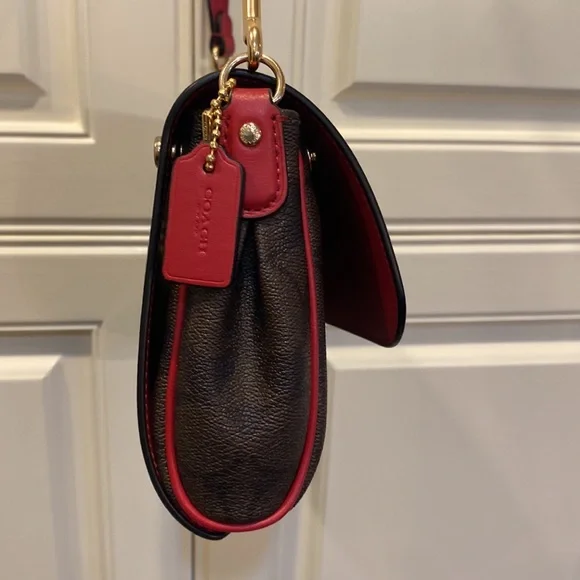 This is a like new coach cross body bag. - Picture 3 of 9